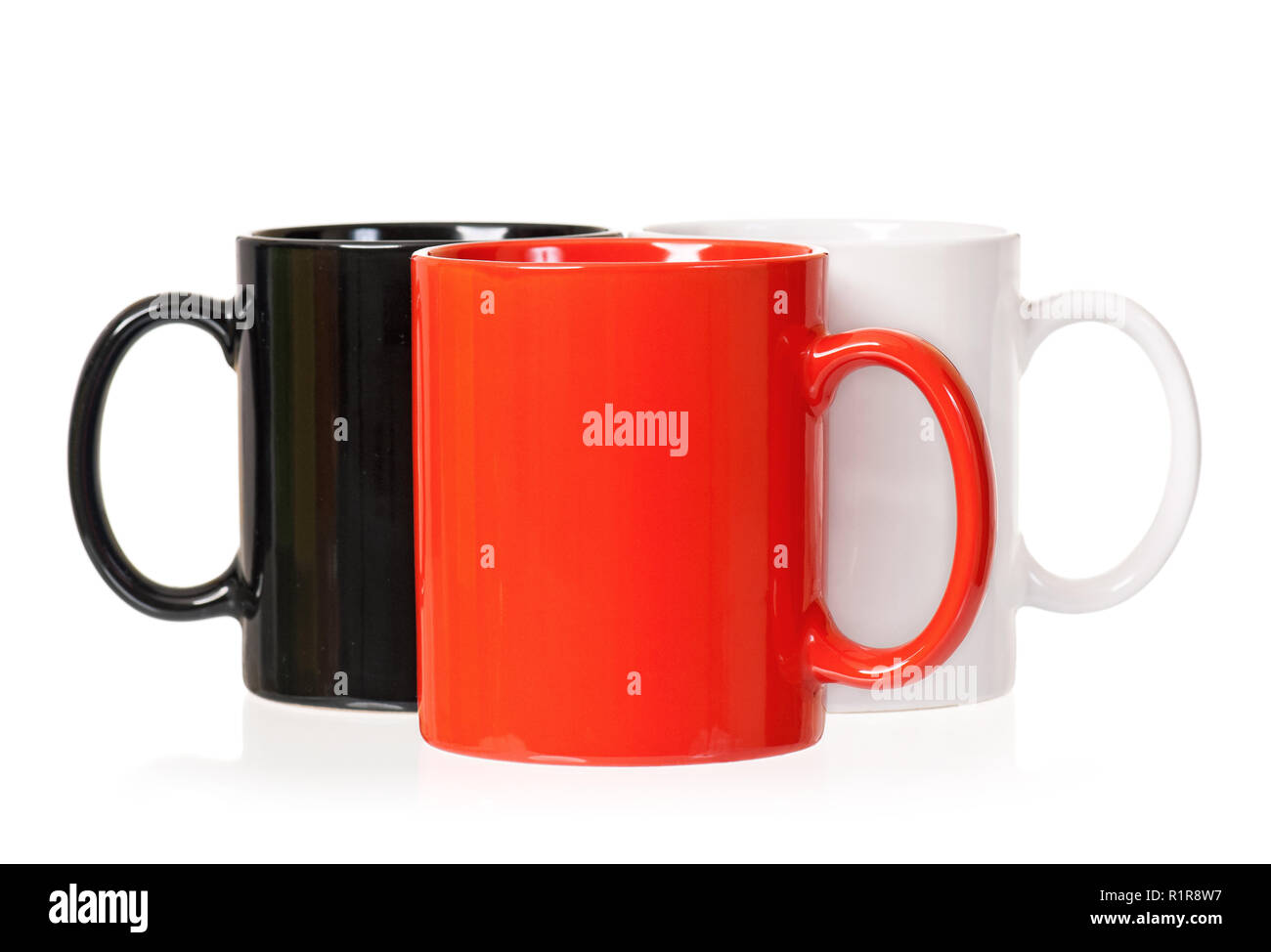 Three cups on white Stock Photo - Alamy