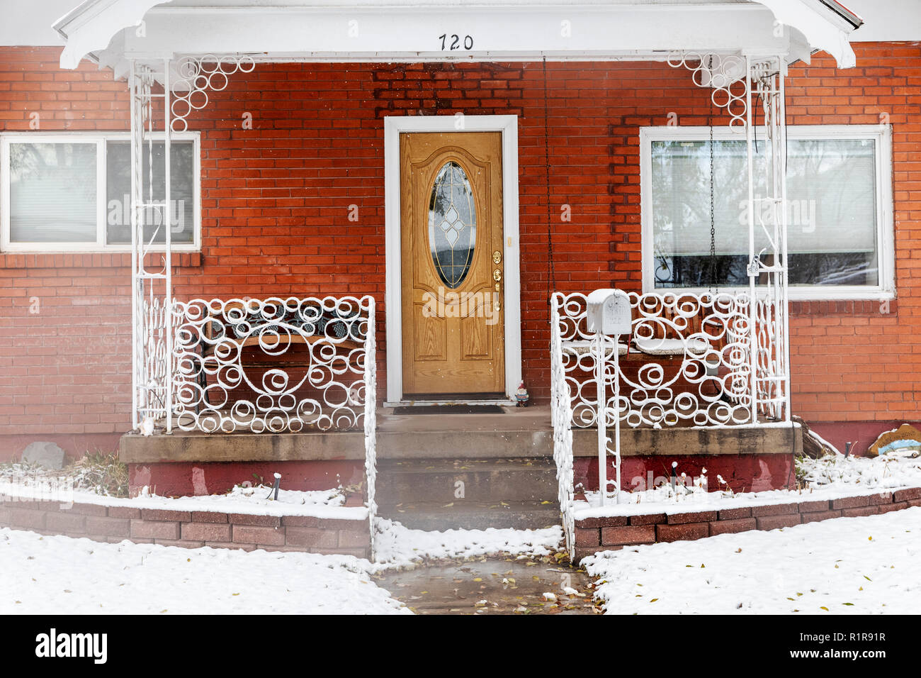 Snow covered wrought iron decorative fence; 720 F Street; Salida; Colorado; USA Stock Photo