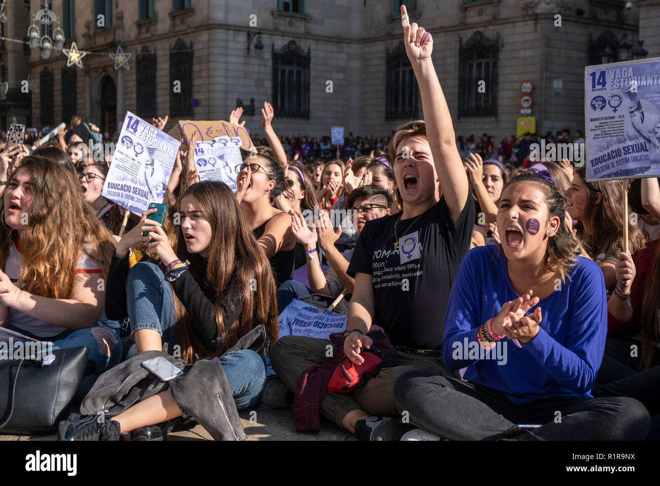 Female demonstrators seen chanting slogans during the sit in protest. Hundreds of student took to the streets of Barcelona during the demonstration to demand gender equality in the Education system. The students are on strike from colleges and universities to join the demonstration. Stock Photo