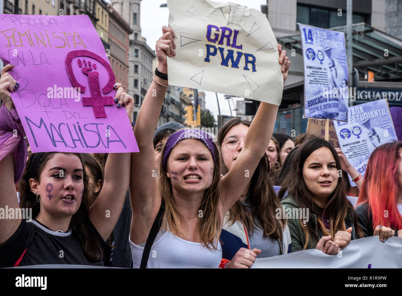 Two young women are seen showing placards during the demonstration. Hundreds of student took to the streets of Barcelona during the demonstration to demand gender equality in the Education system. The students are on strike from colleges and universities to join the demonstration. Stock Photo
