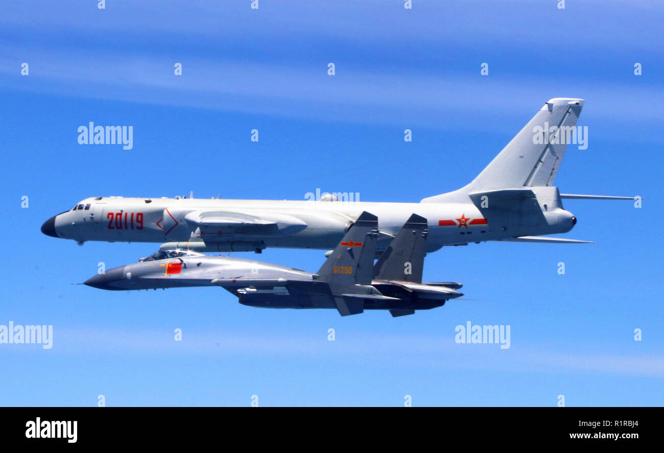 (181114) -- BEIJING, Nov. 14, 2018 (Xinhua) -- A Chinese People's Liberation Army (PLA) air force formation conducts island patrols during training on April 26, 2018. The Chinese Air Force announced a roadmap for building a stronger modern air force in three steps. The building of a stronger modern air force is in line with the overall goal of building national defense and the armed forces, Lieutenant General Xu Anxiang, deputy commander of Chinese Air Force, said at a press conference on celebrating the 69th anniversary of the establishment of Chinese Air Force held in Zhuhai, south China's G Stock Photo