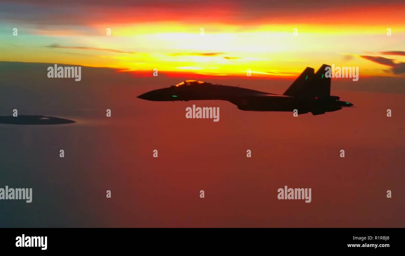 (181114) -- BEIJING, Nov. 14, 2018 (Xinhua) -- Photo of a video capture shows Su-35 fighter jets are on patrol Feb. 7, 2018. The Chinese Air Force announced a roadmap for building a stronger modern air force in three steps. The building of a stronger modern air force is in line with the overall goal of building national defense and the armed forces, Lieutenant General Xu Anxiang, deputy commander of Chinese Air Force, said at a press conference on celebrating the 69th anniversary of the establishment of Chinese Air Force held in Zhuhai, south China's Guangdong Province, Nov. 11, 2018. (Xinhua) Stock Photo
