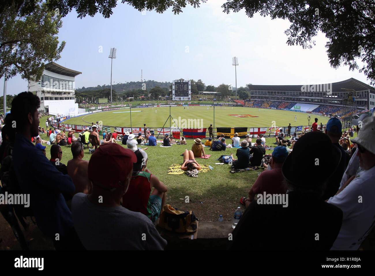 Kandy, Sri Lanka. 14th Nov, 2018.  International Test Cricket, second test, day 1, Sri Lanka versus England; Fans take shade from the sunshine as England struggle after losing 4 wickets before lunch Credit: Action Plus Sports Images/Alamy Live News Stock Photo