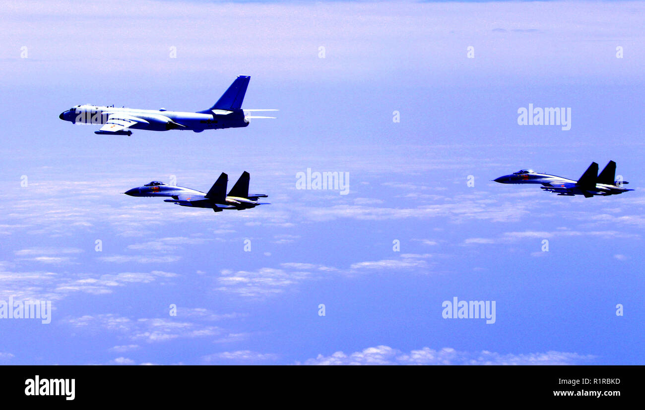 (181114) -- BEIJING, Nov. 14, 2018 (Xinhua) -- Chinese air force formation including H-6K bombers conduct island patrol in April 19, 2018. The Chinese Air Force announced a roadmap for building a stronger modern air force in three steps. The building of a stronger modern air force is in line with the overall goal of building national defense and the armed forces, Lieutenant General Xu Anxiang, deputy commander of Chinese Air Force, said at a press conference on celebrating the 69th anniversary of the establishment of Chinese Air Force held in Zhuhai, south China's Guangdong Province, Nov. 11, Stock Photo