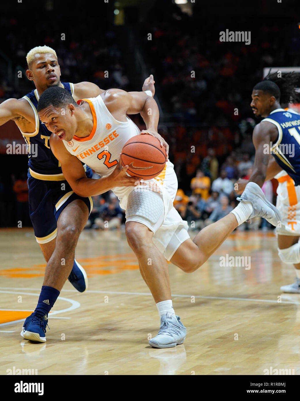 Knoxville, Tennessee, USA. 13th Nov, 2018. November 13, 2018: Grant Williams #2 of the Tennessee Volunteers drives to the basket against Brandon Alston #4 of the Georgia Tech Yellow Jackets during the NCAA basketball game between the University of Tennessee Volunteers and the Georgia Tech Yellow Jackets at Thompson Boling Arena in Knoxville TN Tim Gangloff/CSM Credit: Cal Sport Media/Alamy Live News Stock Photo