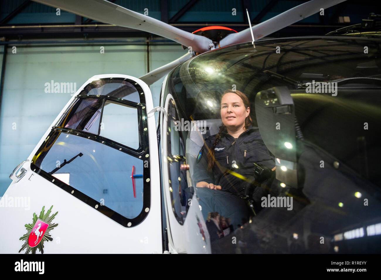 Rastede, Germany. 14th Nov, 2018. Kirsten Böning, the first female helicopter pilot of the Lower Saxony Police, is sitting in a police helicopter. Credit: Mohssen Assanimoghaddam/dpa/Alamy Live News Stock Photo