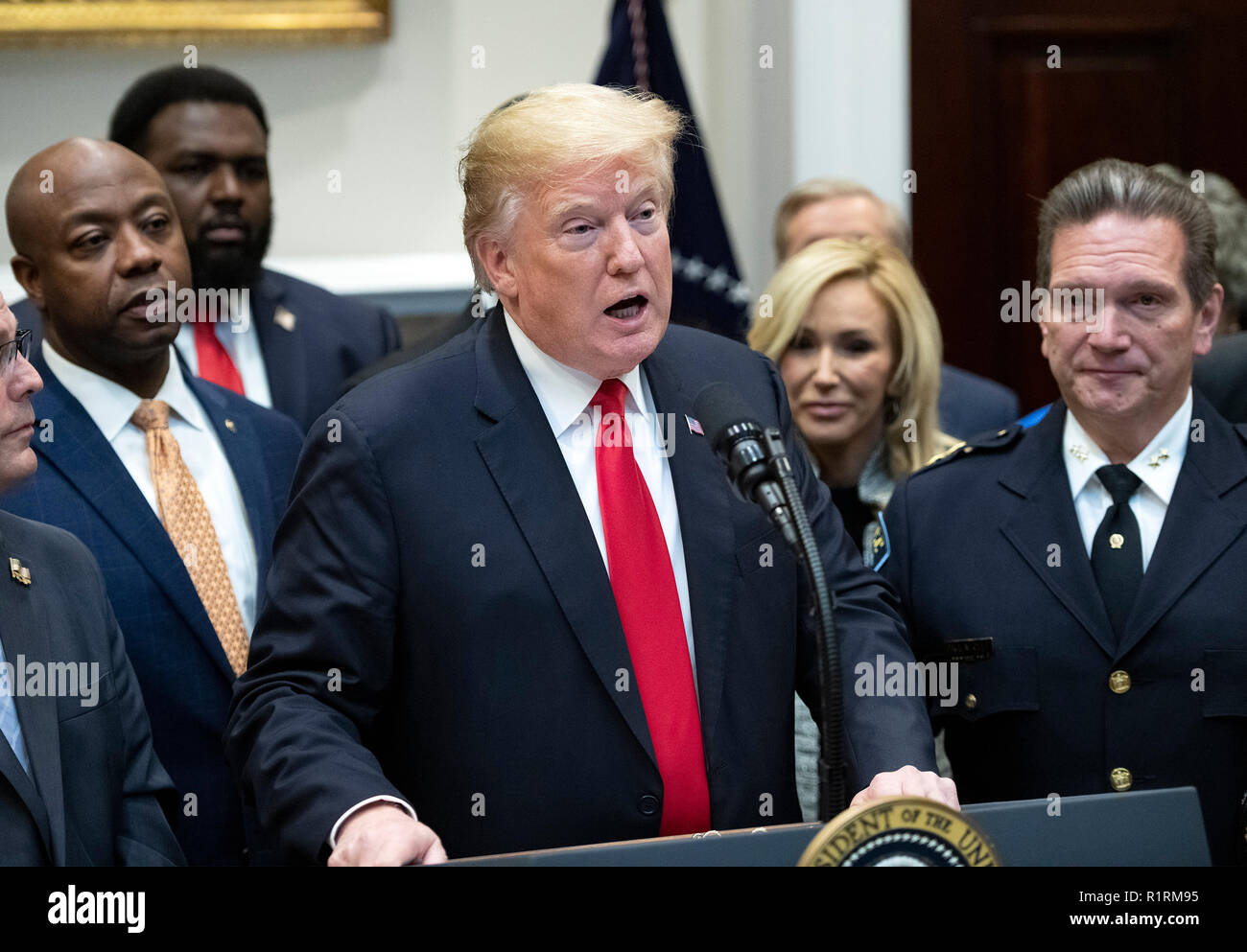 united-states-president-donald-j-trump-announces-his-support-of-h-r-5682-the-first-step-act-in-the-roosevelt-room-of-the-white-house-in-washington-dc-on-wednesday-november-14-2018-according-to-the-website-congressgov-this-bill-is-titled-the-formerly-incarcerated-reenter-society-transformed-safely-transitioning-every-person-act-or-the-first-step-act-it-enjoys-bipartisan-support-looking-on-are-us-senator-tim-scott-republican-of-south-carolina-left-and-chief-paul-cell-president-international-association-of-chiefs-of-police-right-credit-ron-sachscnp-usage-worldwide-R1RM95.jpg