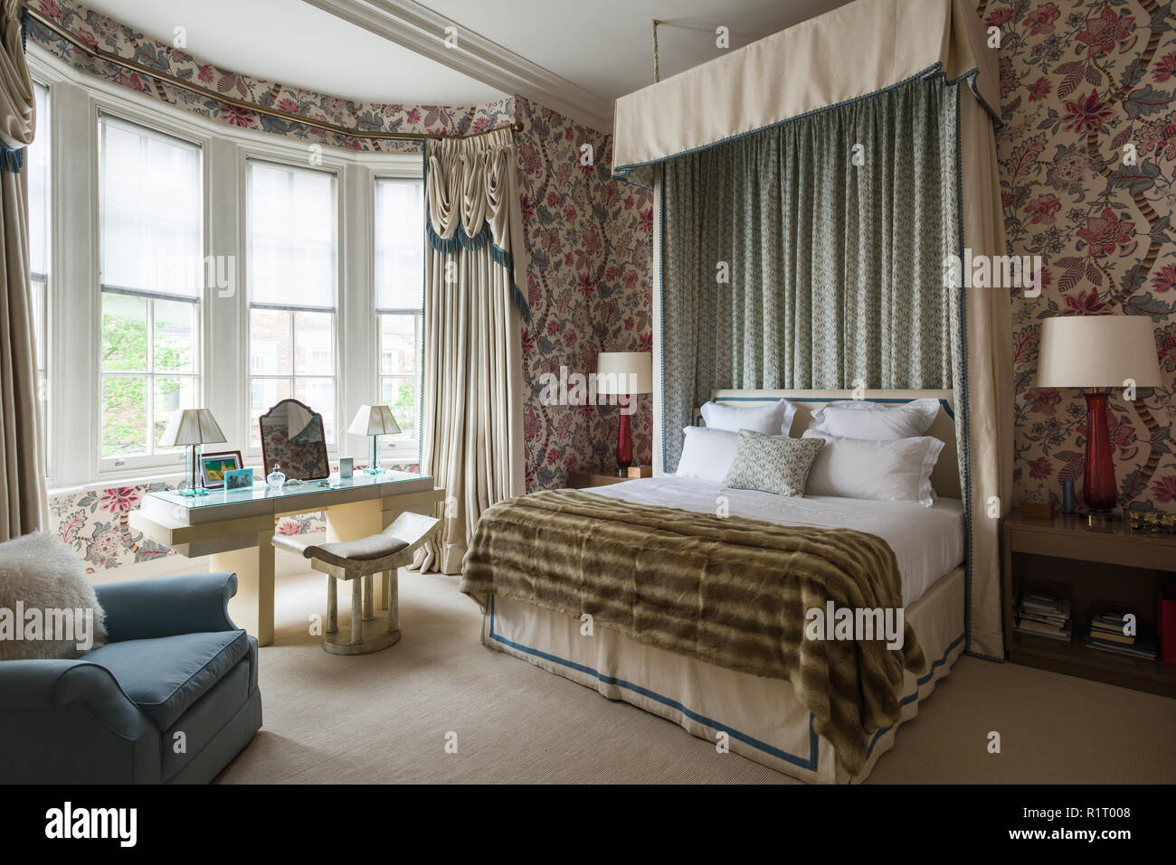 Edwardian bedroom with floral wallpaper Stock Photo