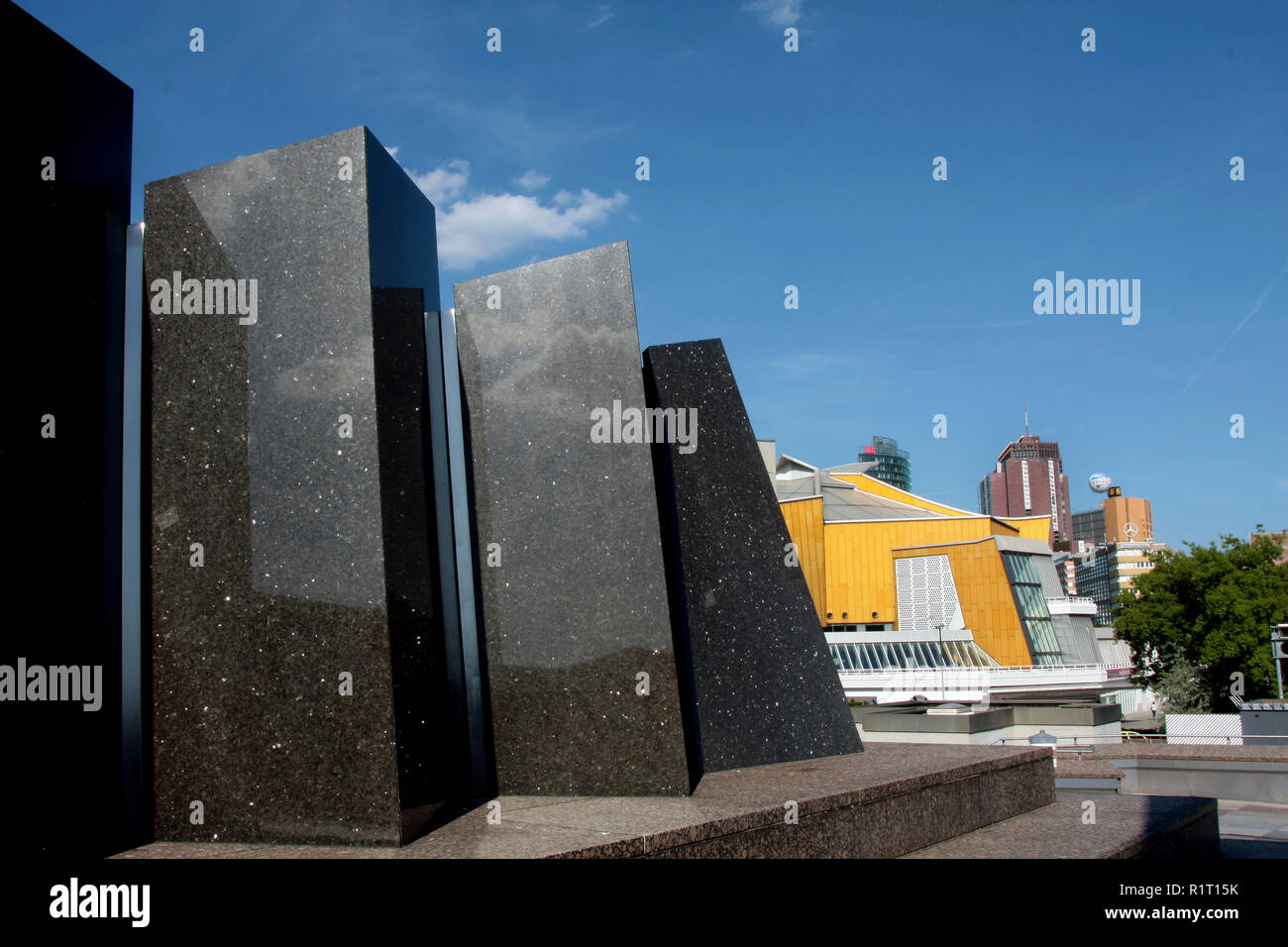 Highly polished marble/granite slabs guide the eye towards the Philharmonie concert hall in Berlin, Germany. Stock Photo