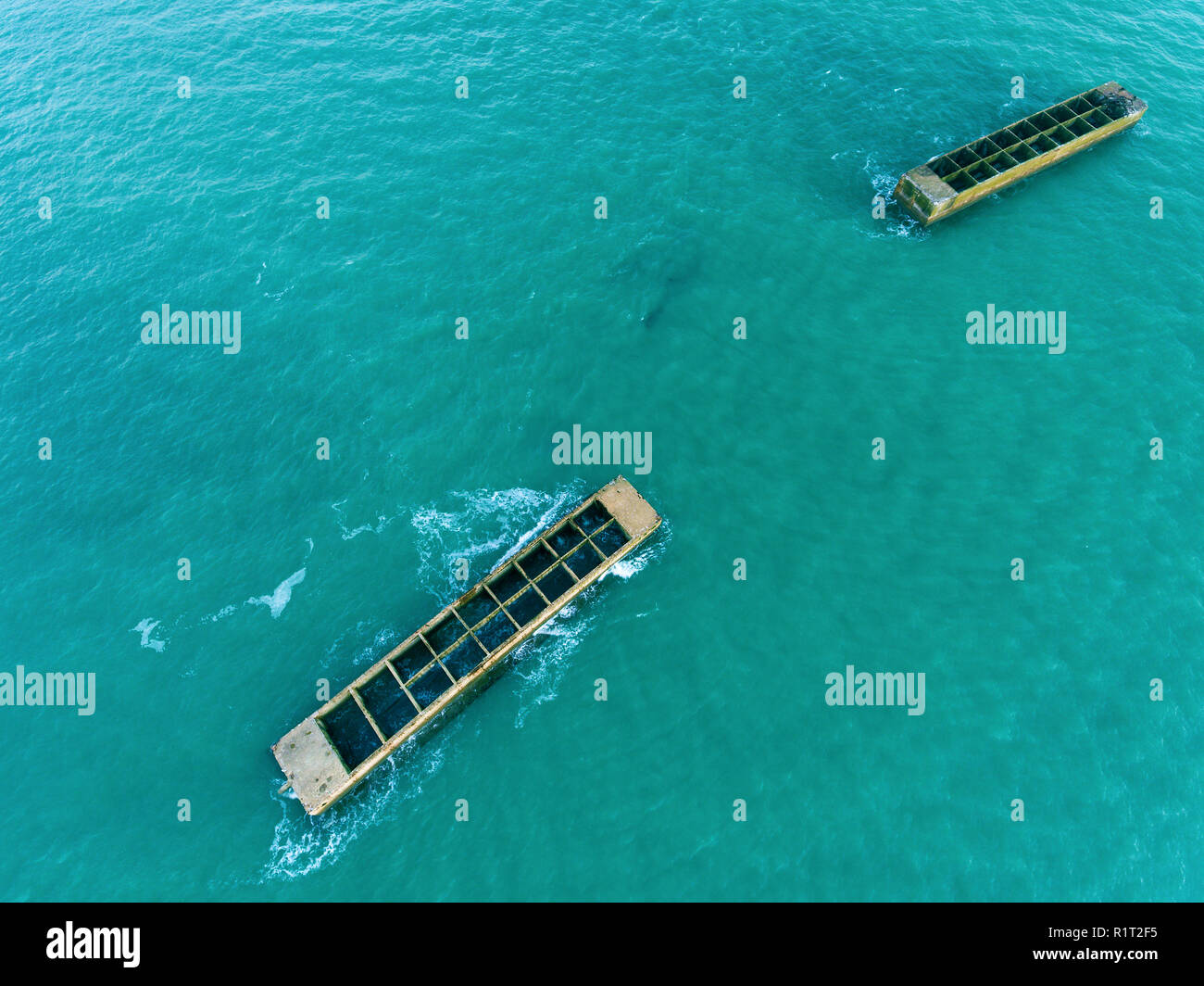 Remains of Mulberry Artificial Harbour from D-Day invasion, Arromanches les Bains, Normandy, France Stock Photo