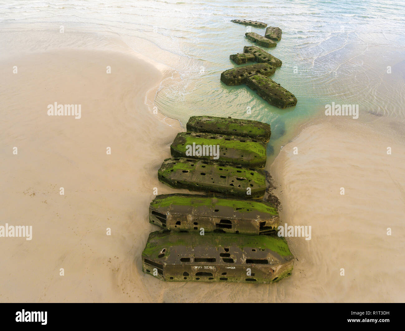 Remains of Mulberry Artificial Harbour from D-Day invasion, Arromanches les Bains, Normandy, France Stock Photo