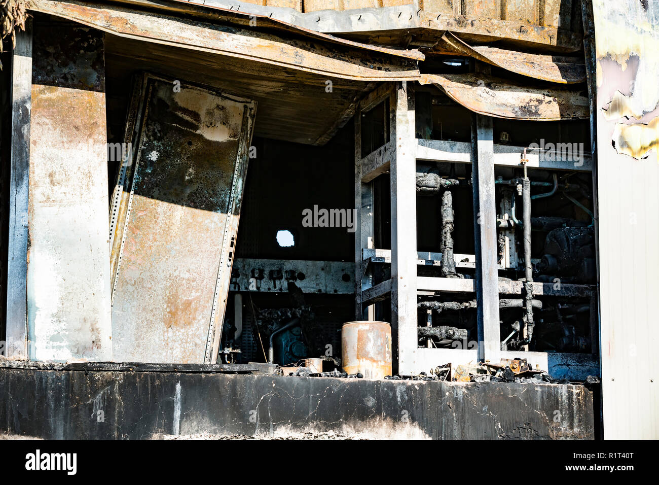 Damaged supermarket boiler room with ventilation, turbine, after arson fire  with burn black dark debris intense burning fire disaster ruins waiting fo  Stock Photo - Alamy