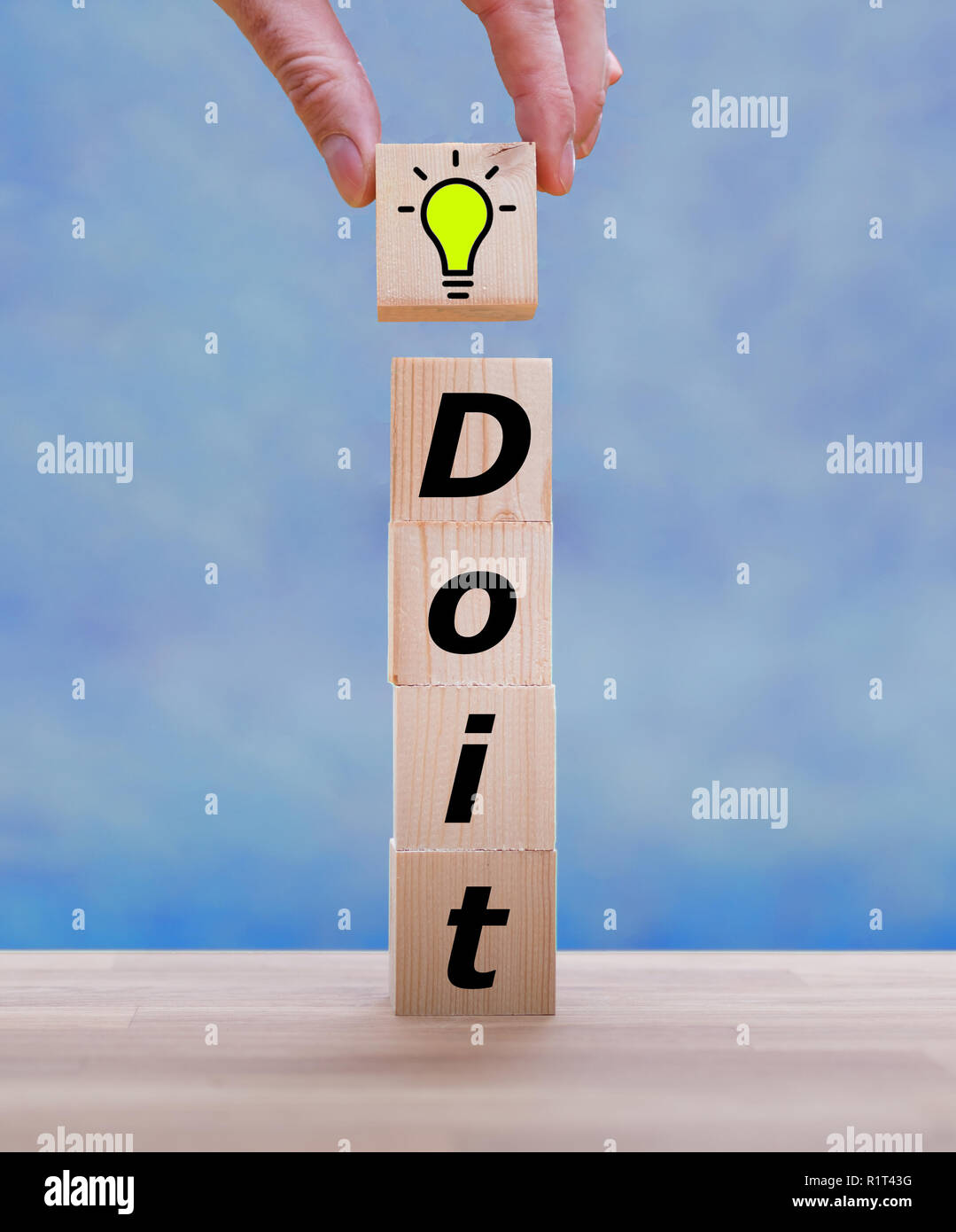 Stack of dices form the words 'Do it' Stock Photo