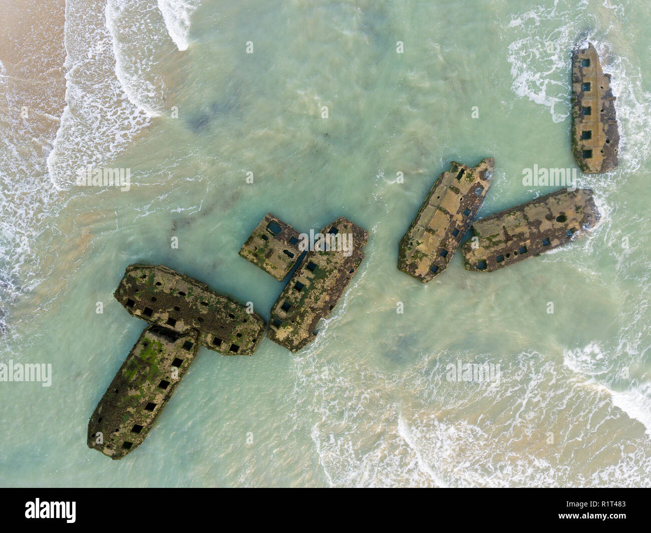 Remains of Mulberry Artificial Harbour from D-Day invasion, Arromanches les Bains, Normandy, France Stock Photo