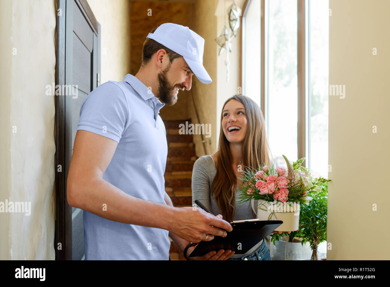 Man delivering flowers Stock Photo
