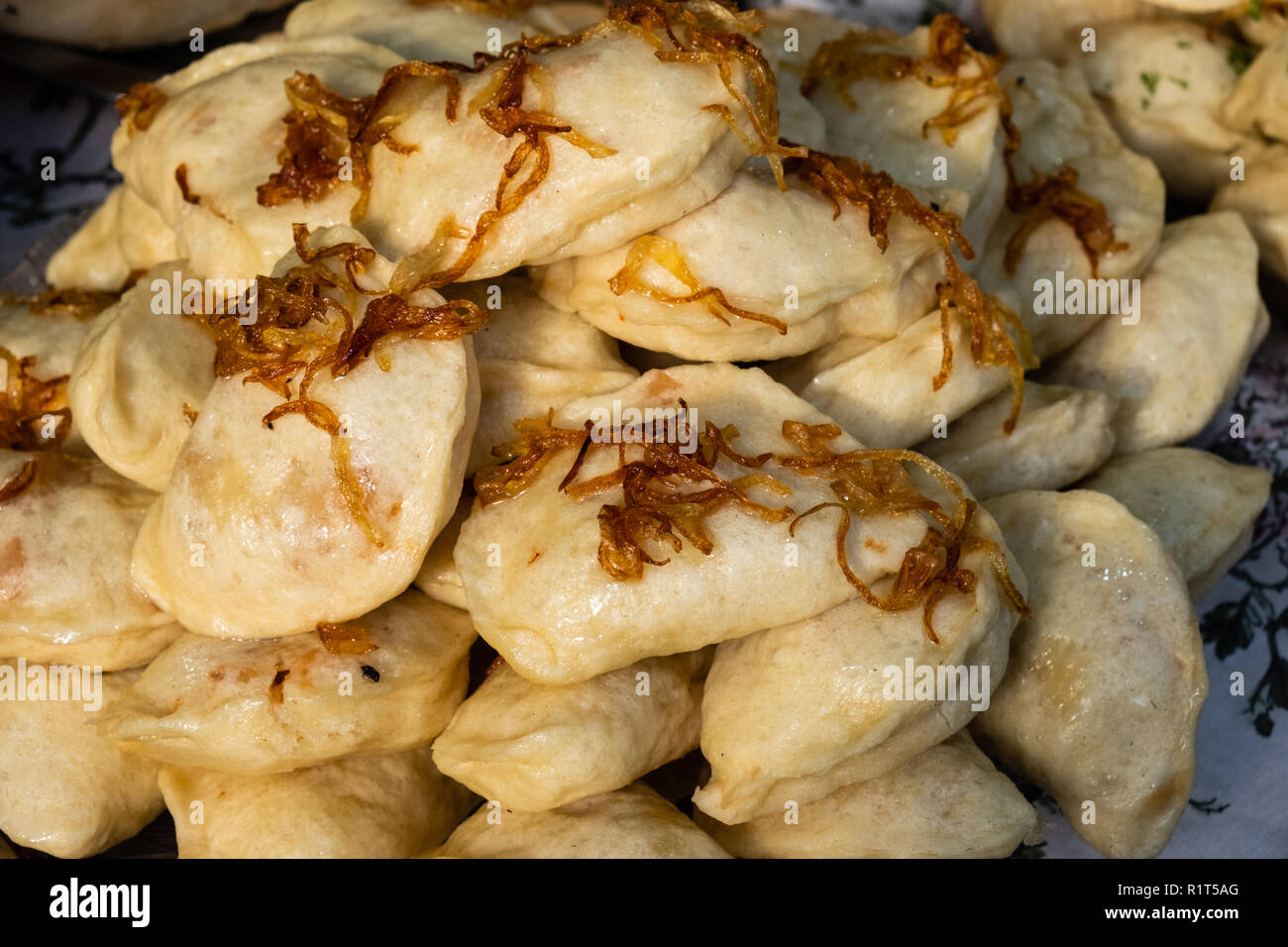 Traditional Ukrainian dumplings with fried onions at the festival of