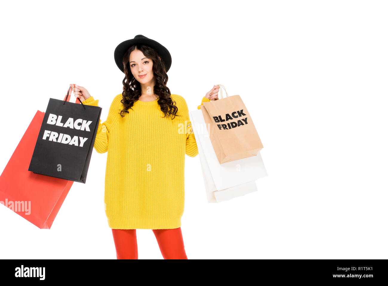 beautiful stylish customer holding shopping bags with black friday symbols, isolated on white Stock Photo