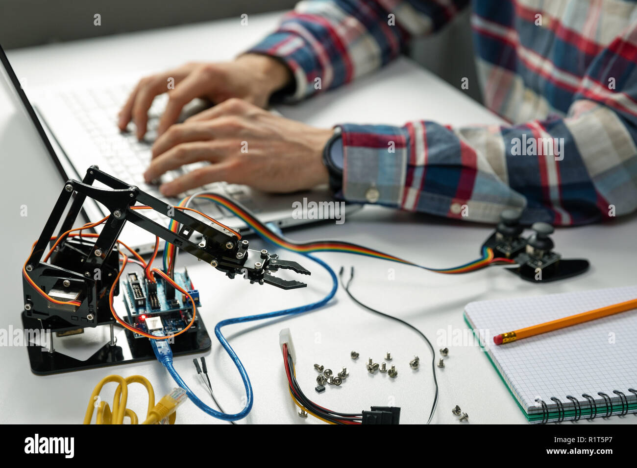 engineer working on robotics automation project Stock Photo