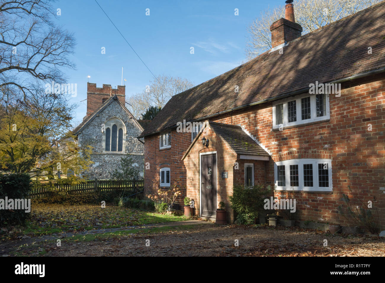 Rotherwick parish church and Church Cottage, on The Street in the small village of Rotherwick in Hampshire, UK Stock Photo