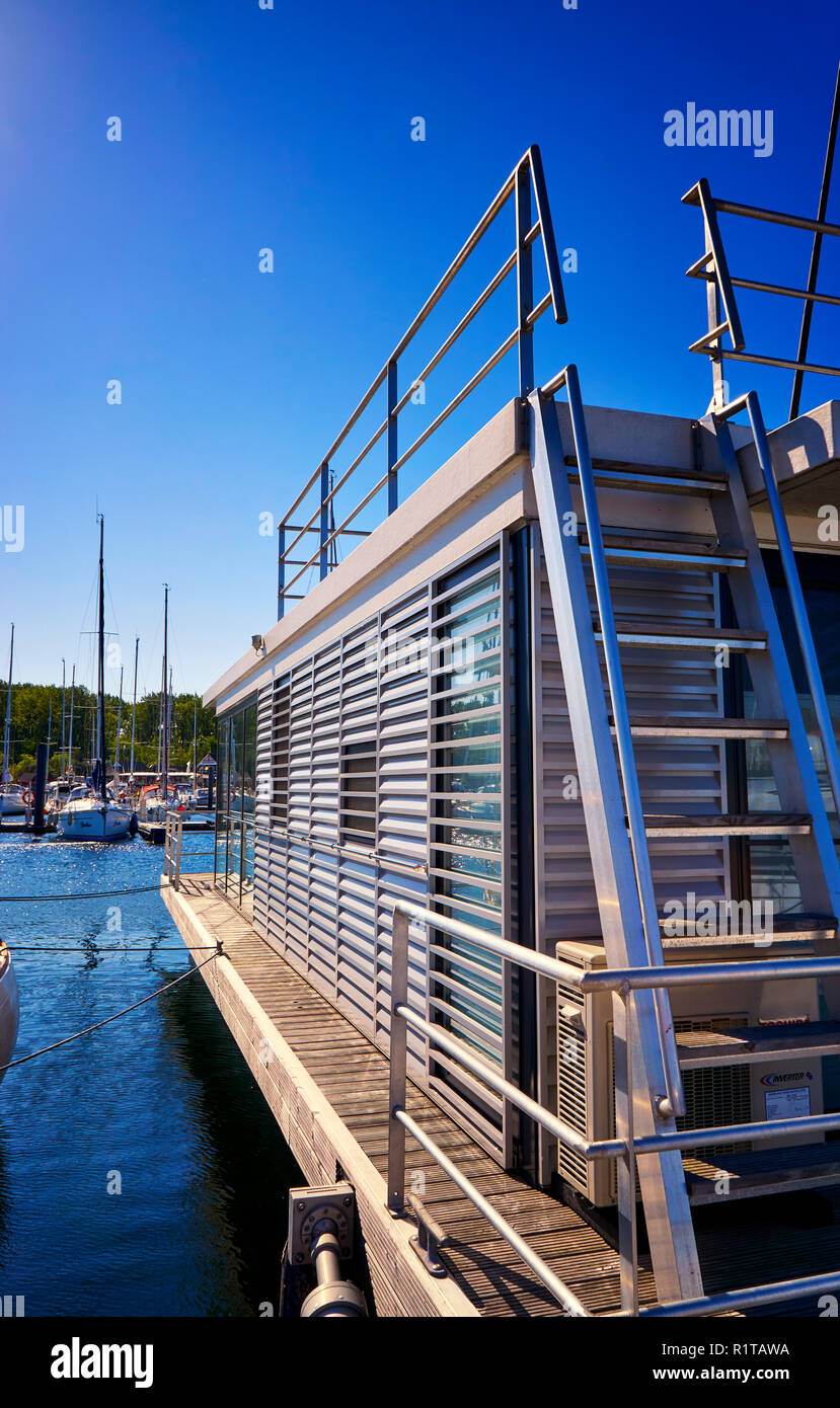 Modern houseboat in the harbor Weiße Wiek Boltenhagen. Germany Stock
