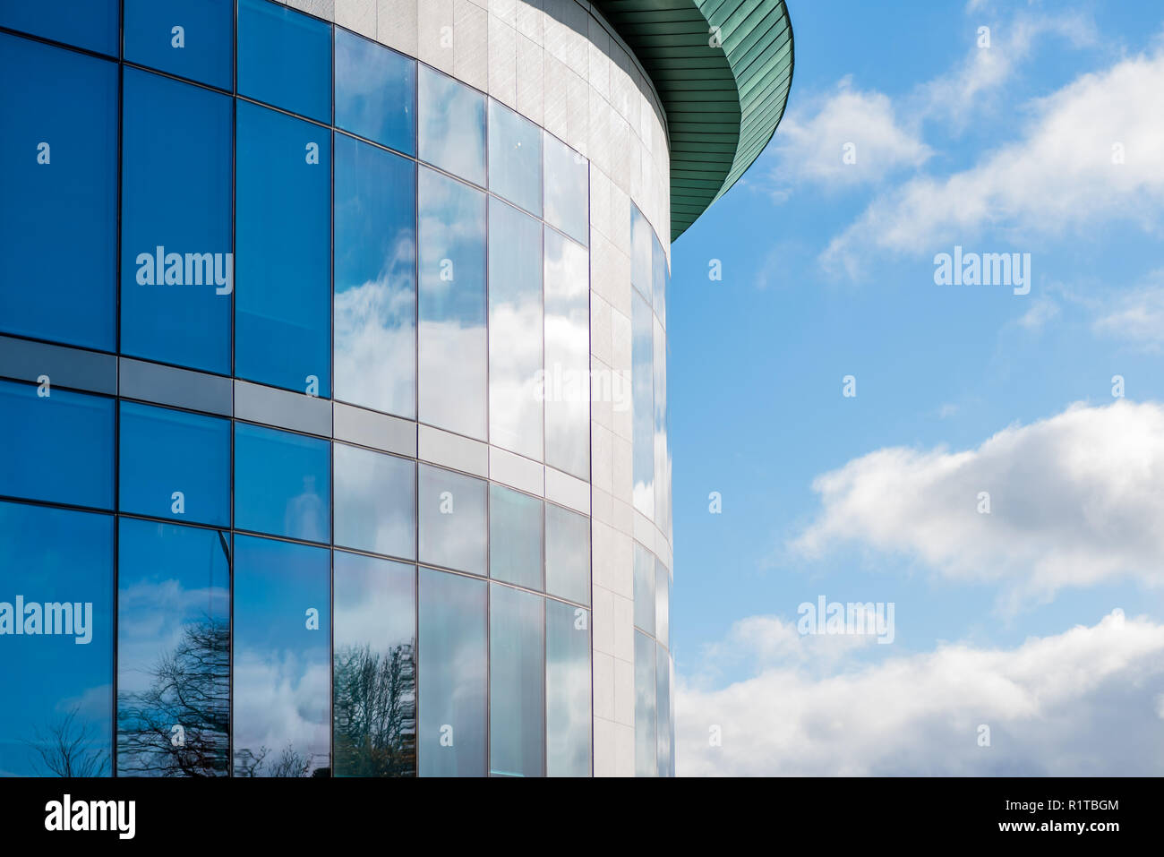sunny day view of windows of modern business corporate office building