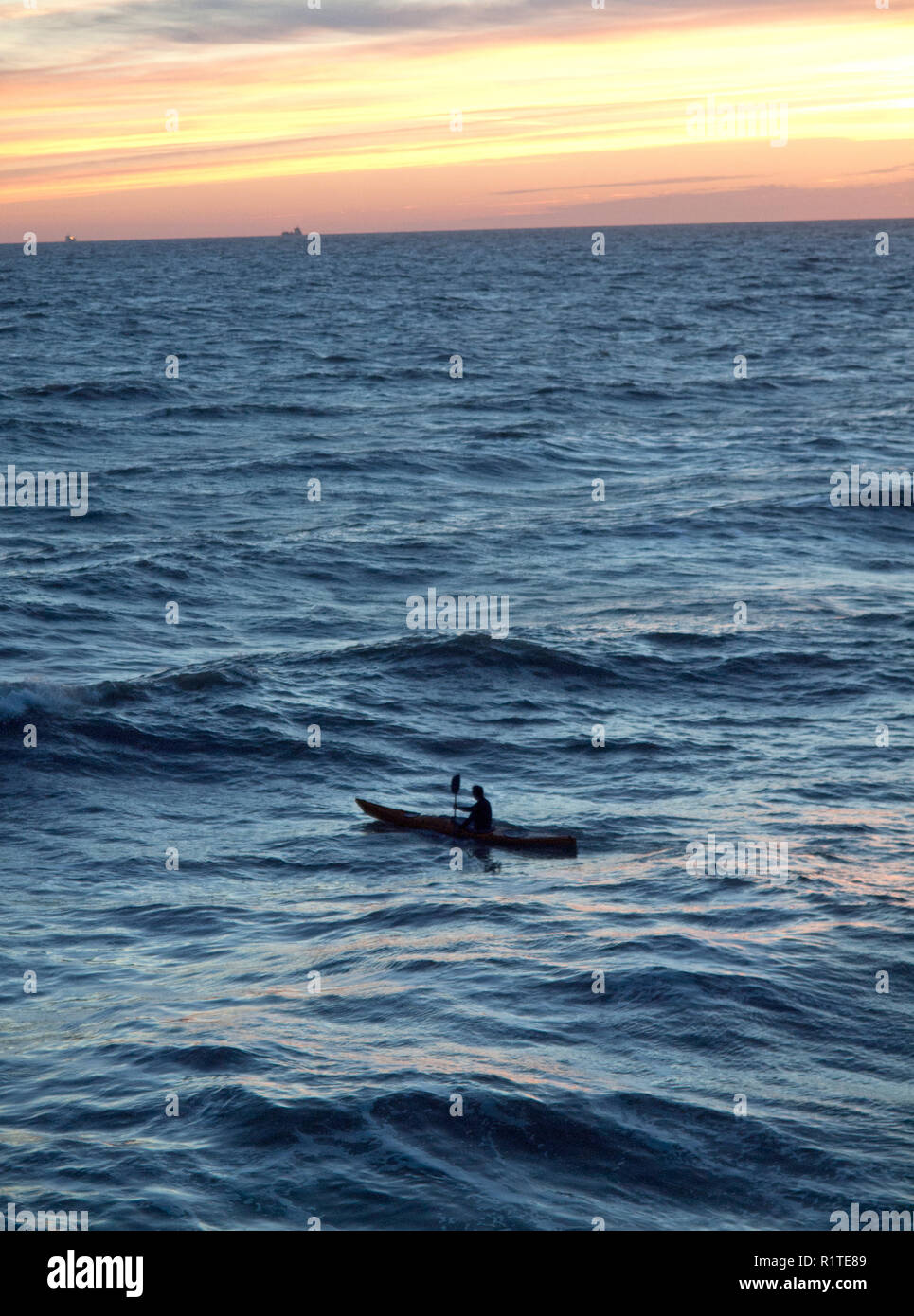 A lone canoeist out at sea near to Brighton Stock Photo