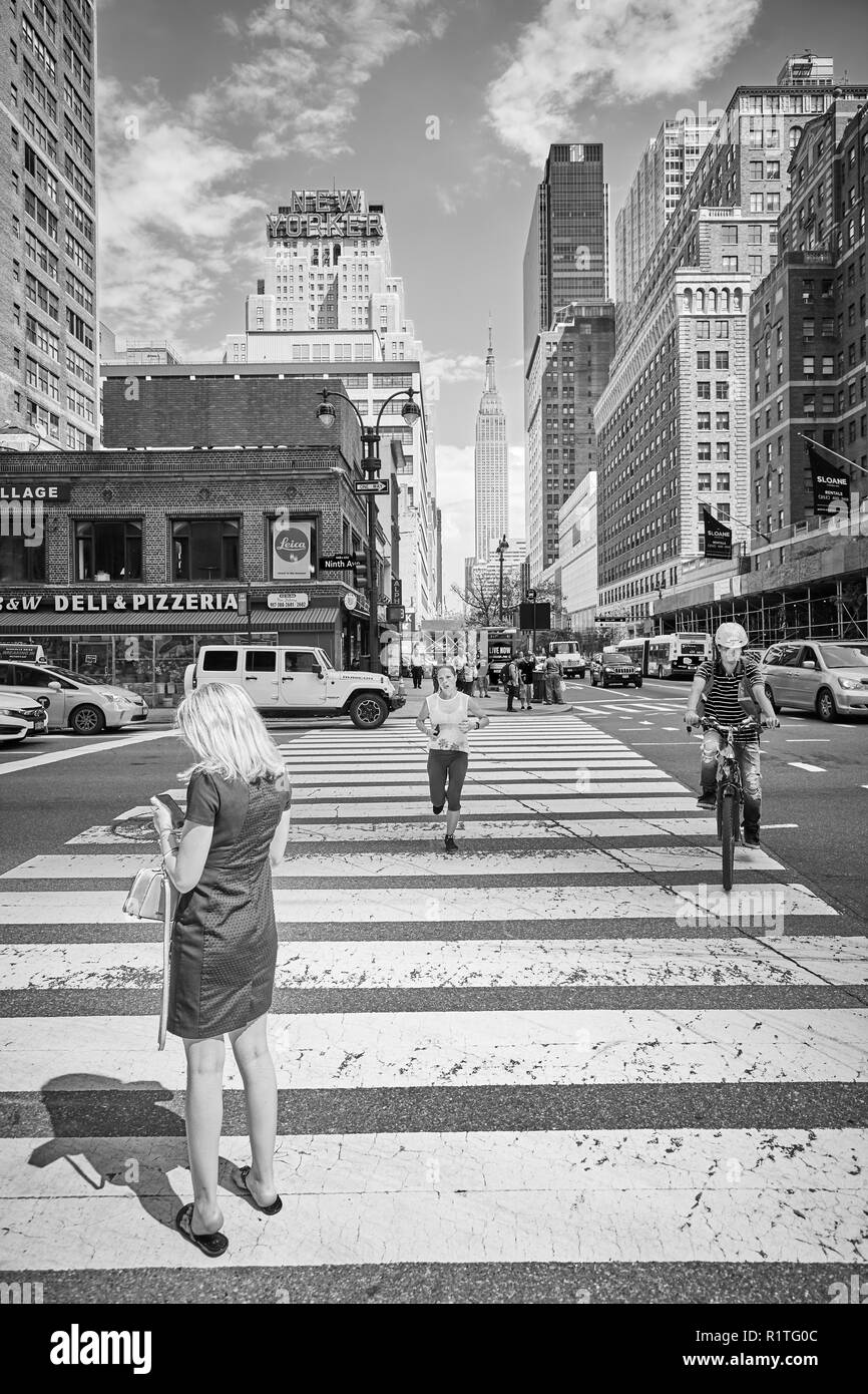 New York, USA - June 28, 2018: City life in the 'Big Apple', this nickname for New York City first introduced in the 1920s by John J. Fitz Gerald. Stock Photo