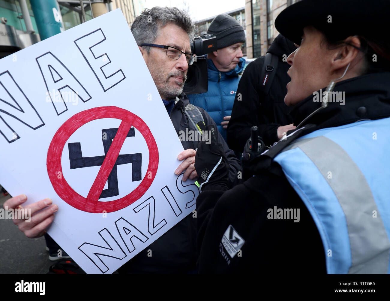 An anti-racism protester outside Edinburgh International Conference Centre, where former White House advisor, Steve Bannon is speaking at the European Broadcasting Union's News Xchange event. Stock Photo