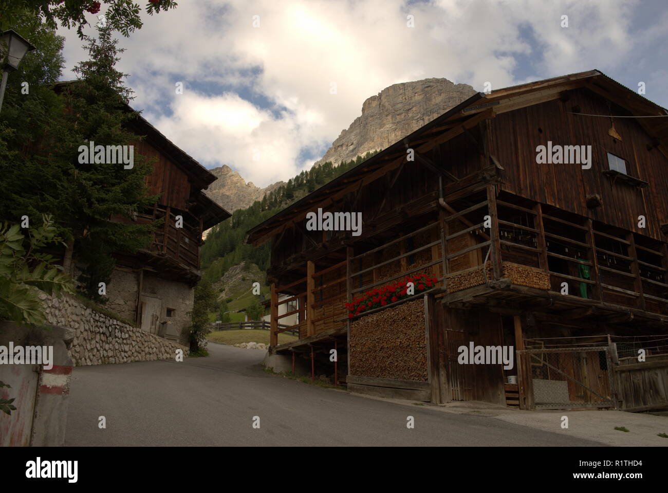Typical alpine houses at the way to the Sassongher mountain at the Alta Badia Stock Photo