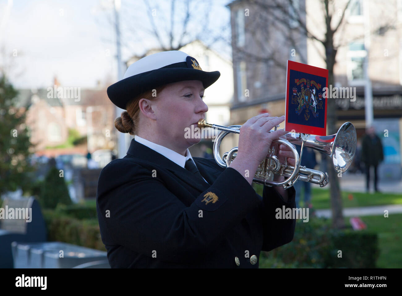 Royal Navy bugler playing Last Post at Remembrance Service in Helensburgh, Argyll, Scotland Stock Photo