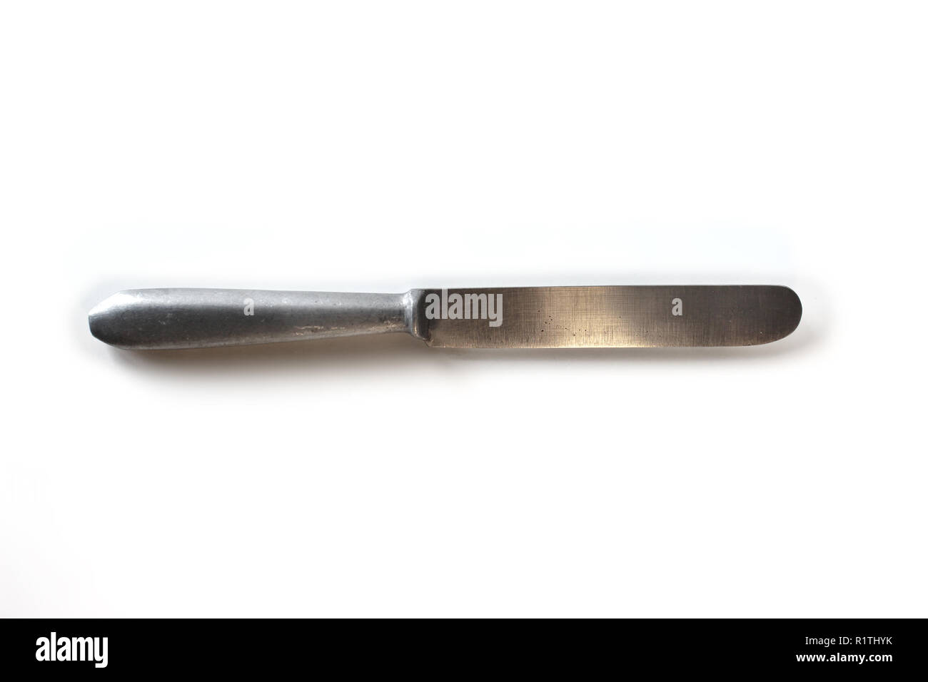 Old silver table knife isolated on a white background Stock Photo