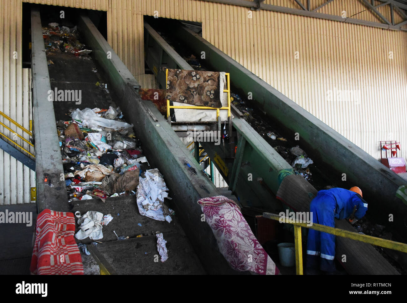 Manual waste sorting line at the mixed-waste processing facility in Astrakhan, Russia Stock Photo