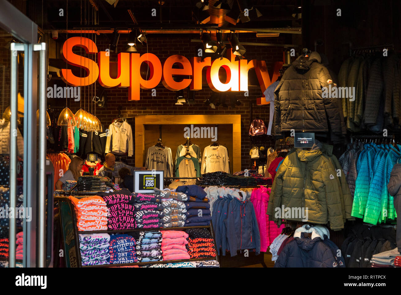 Socialistisch Door brand Superdry clothing store, ashford, kent, uk Stock Photo - Alamy