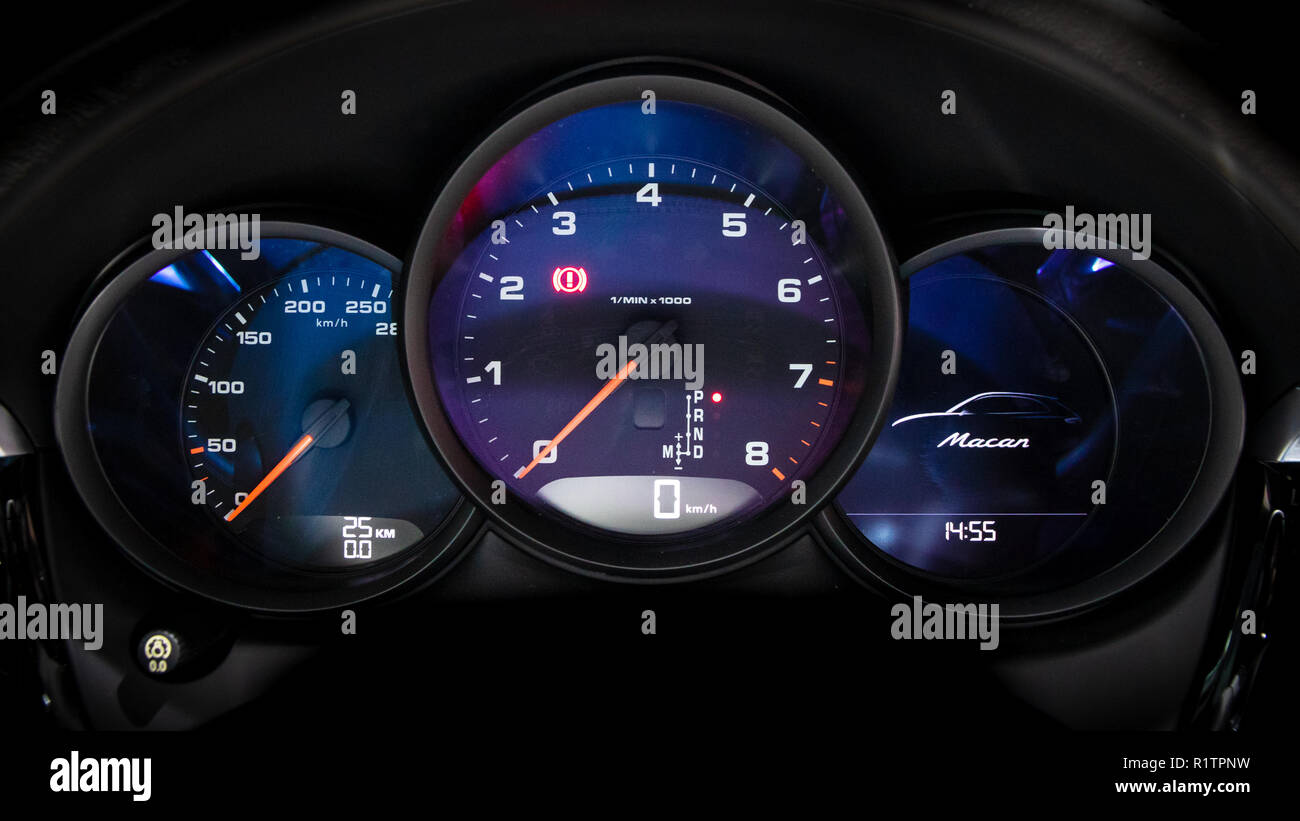 PARIS - OCT 3, 2018: Modern digital dashboard gauges inside the new Porsche Macan car showcased at the Paris Motor Show. Stock Photo