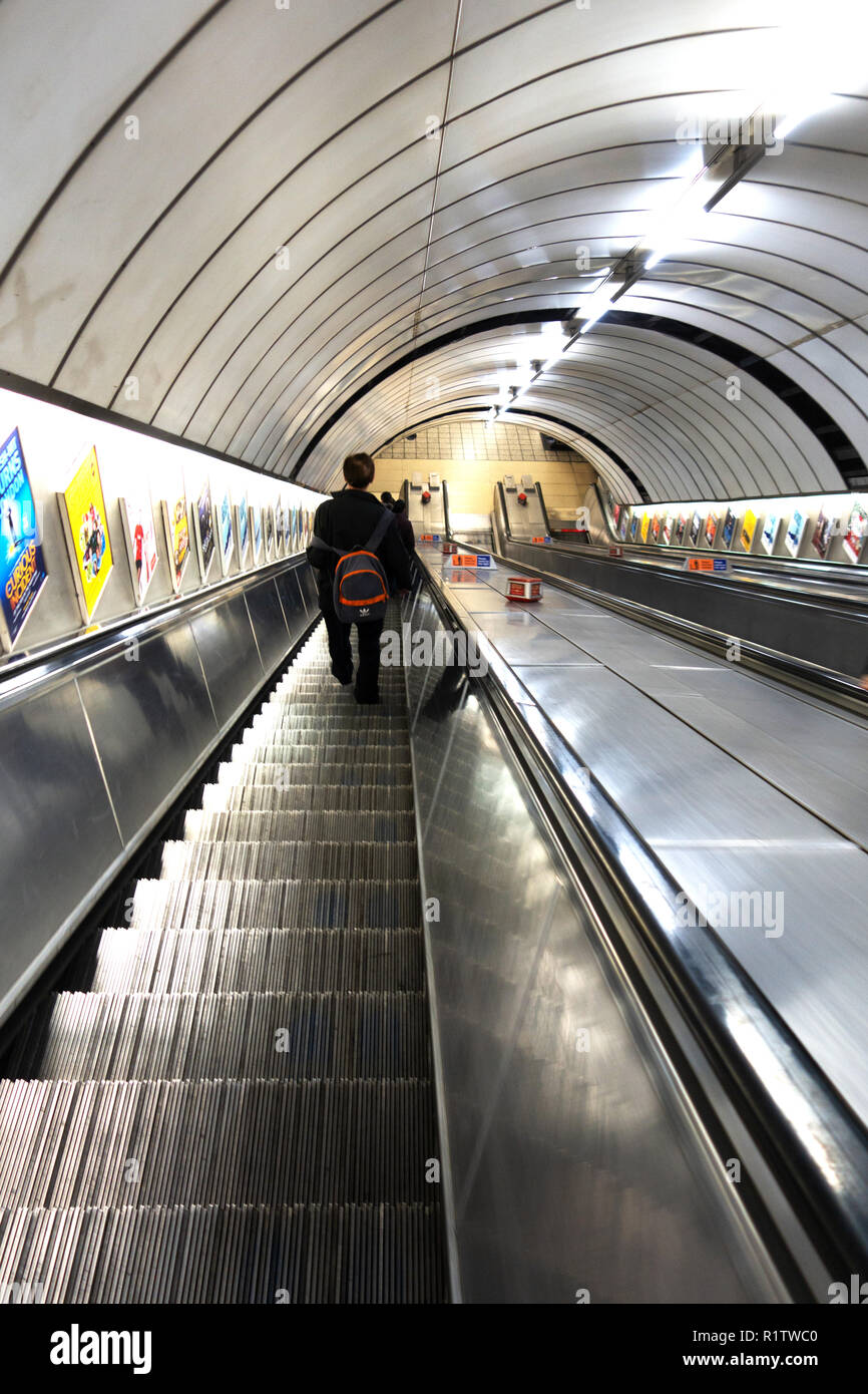 Tube commuters time, London commuters travelling down the Underground escalators Stock Photo Alamy