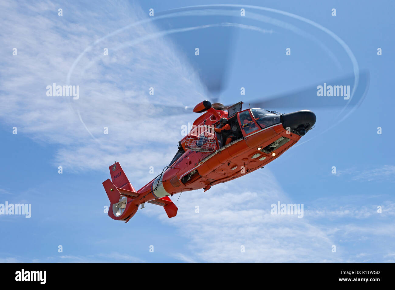helicopter, coast guard helicopter, united states coast guard, uscg, dolphin, mh-65, mh-65c, flight mechanic, pilot, aviation, san francisco, rescue,  Stock Photo