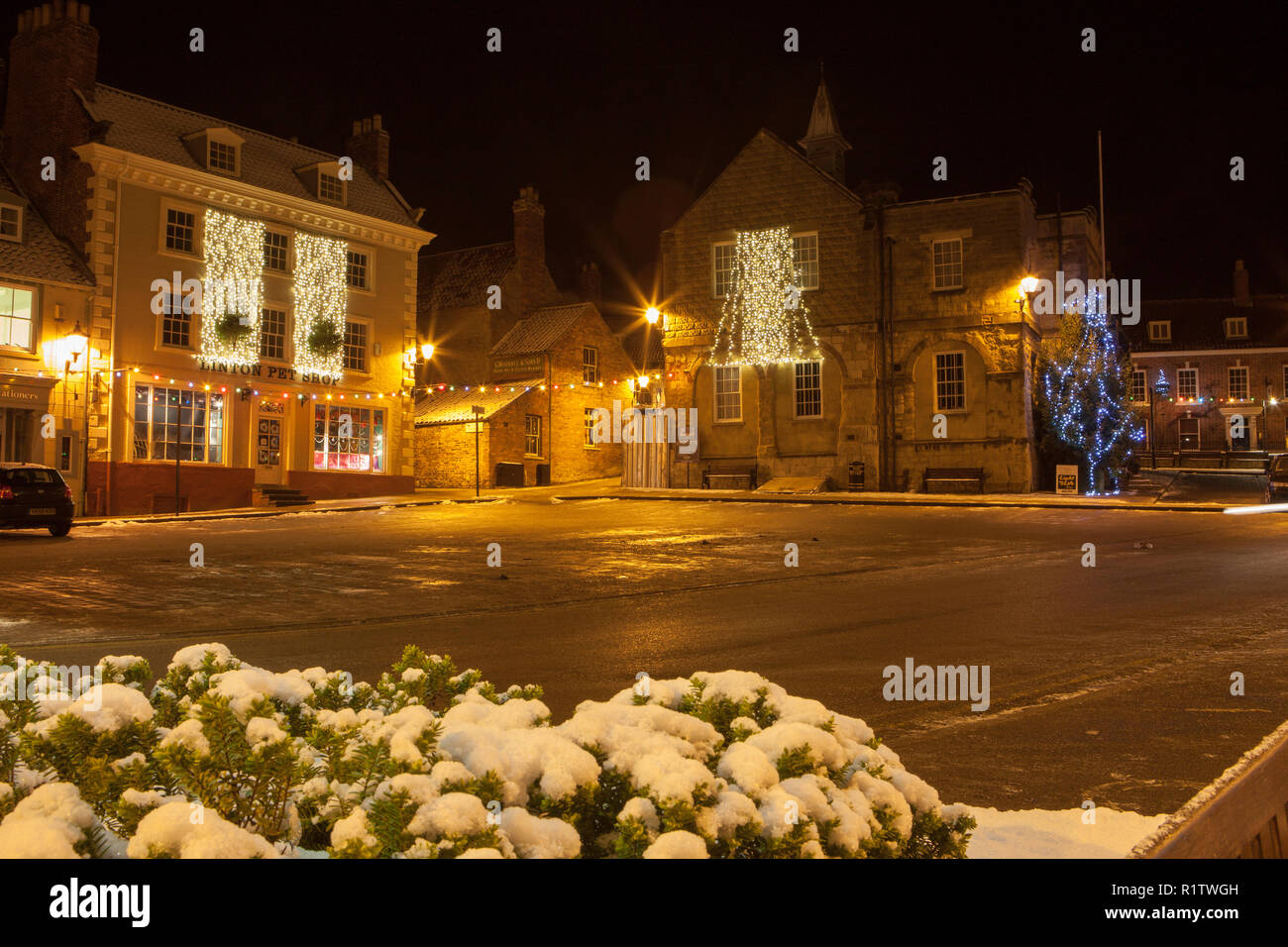 View of Malton's market place at night with Christmas decorations and