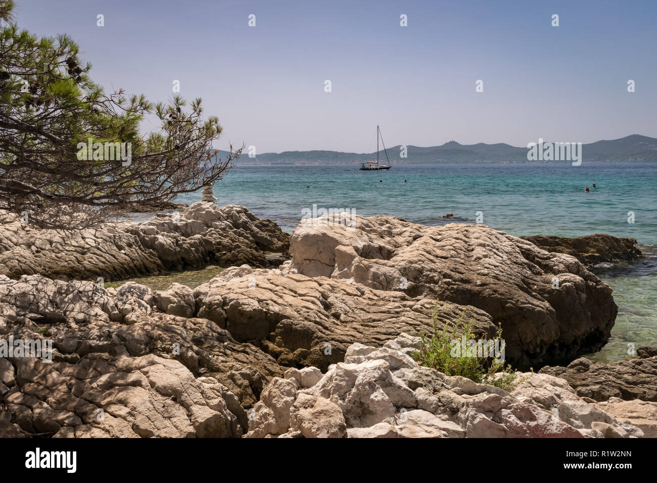 The dalmatian coast near Zadar, Croatia. The landscape, the beautiful blue calm sea and warm temperatures makes this a favorite area for vacations. Stock Photo