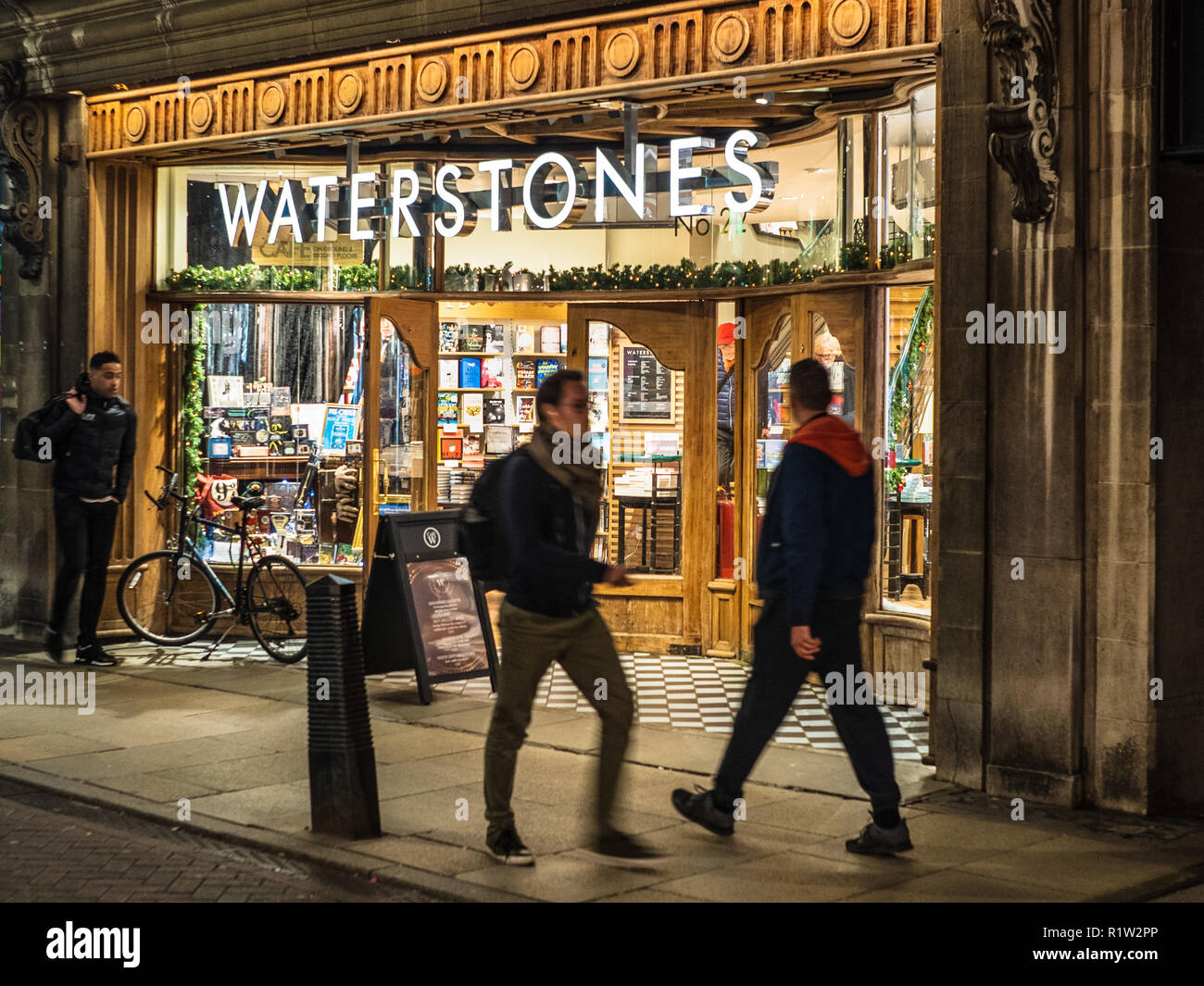 Waterstones Bookshop / Waterstones Bookstore at dusk - the refurbished Waterstones bookshop in central Cambridge UK Stock Photo