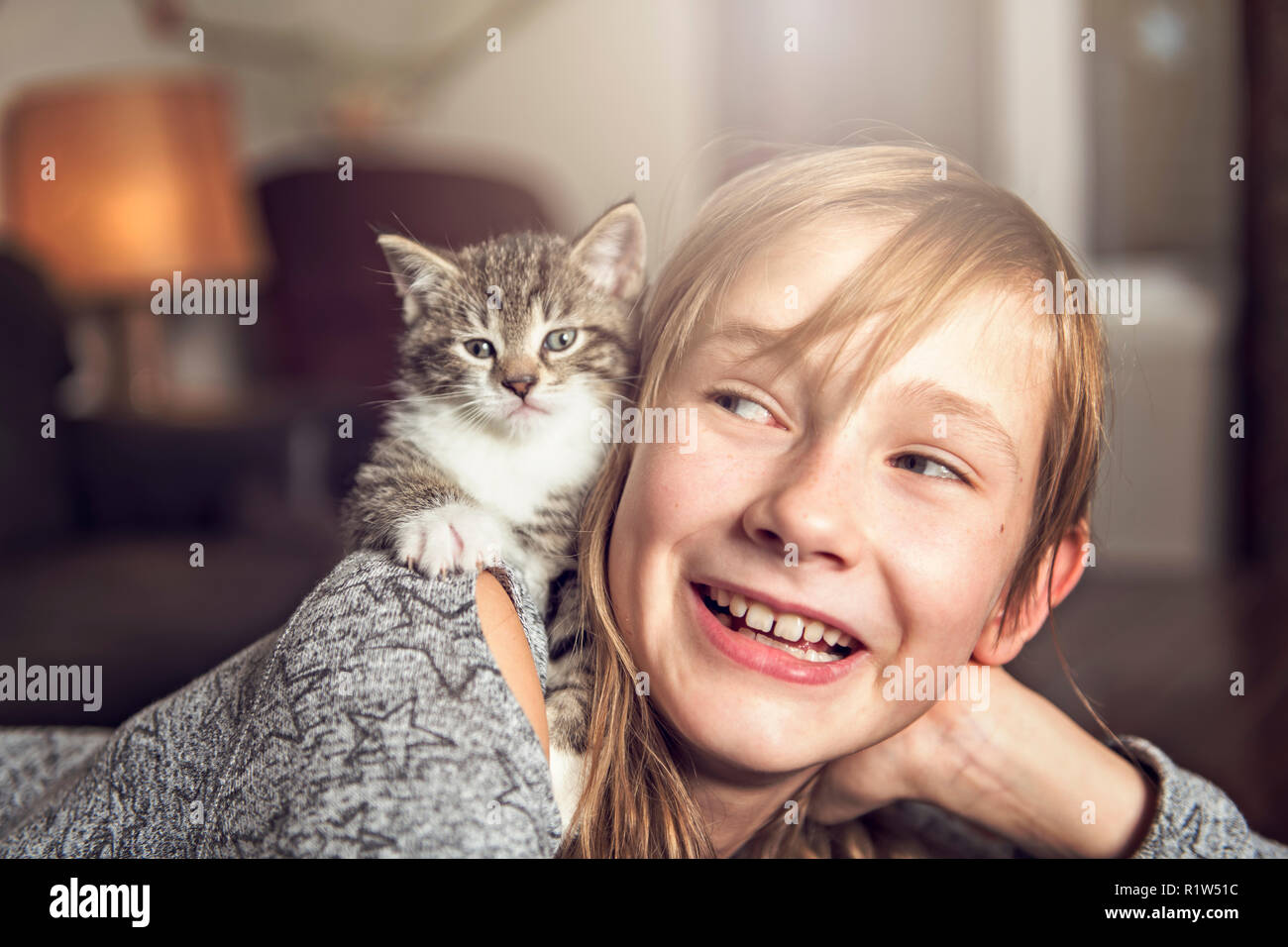 Preteen girl on sofa hi-res stock photography and images - Alamy