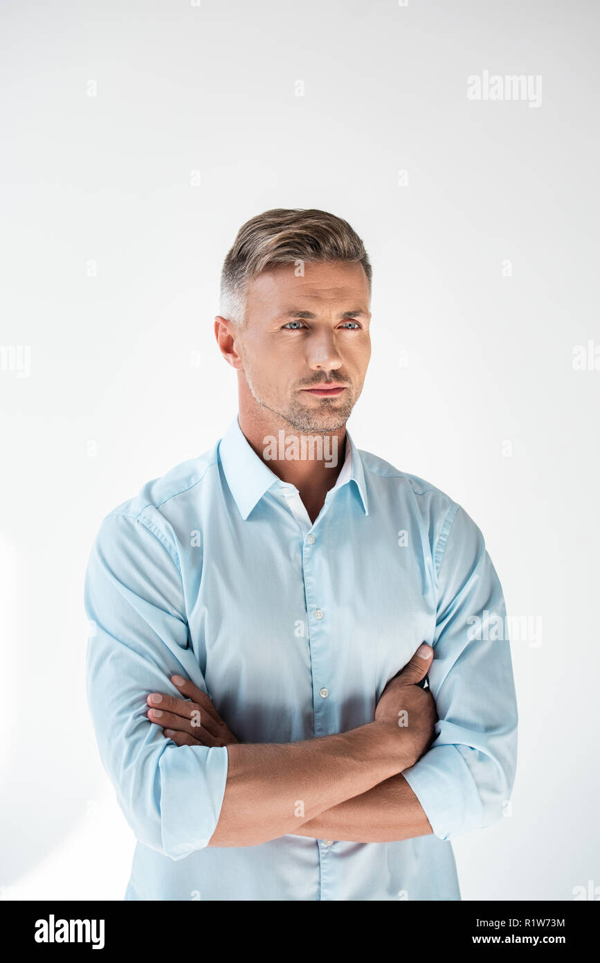 handsome adult man with crossed arms looking away isolated on white ...