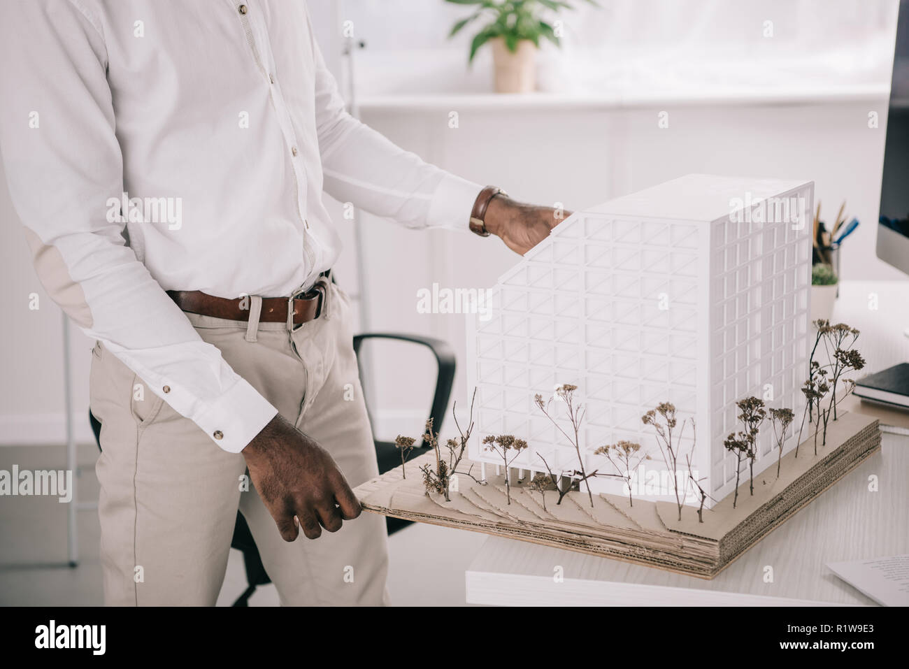 cropped image of african american architect working on architecture model in office Stock Photo
