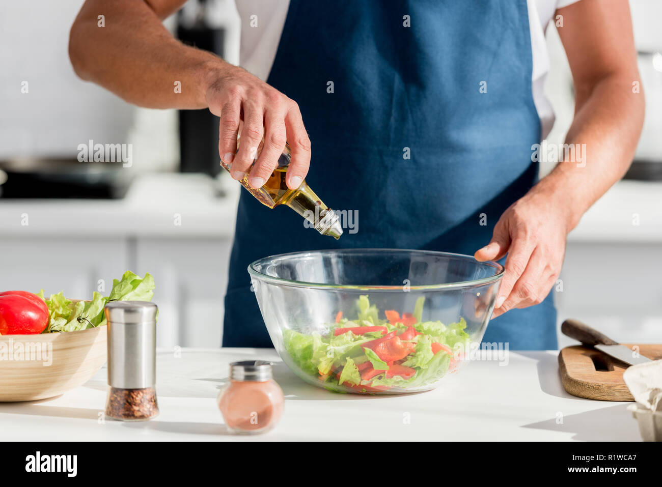 Adding Fresh Oil Cropped view man adding fresh hi-res stock photography and images - Alamy