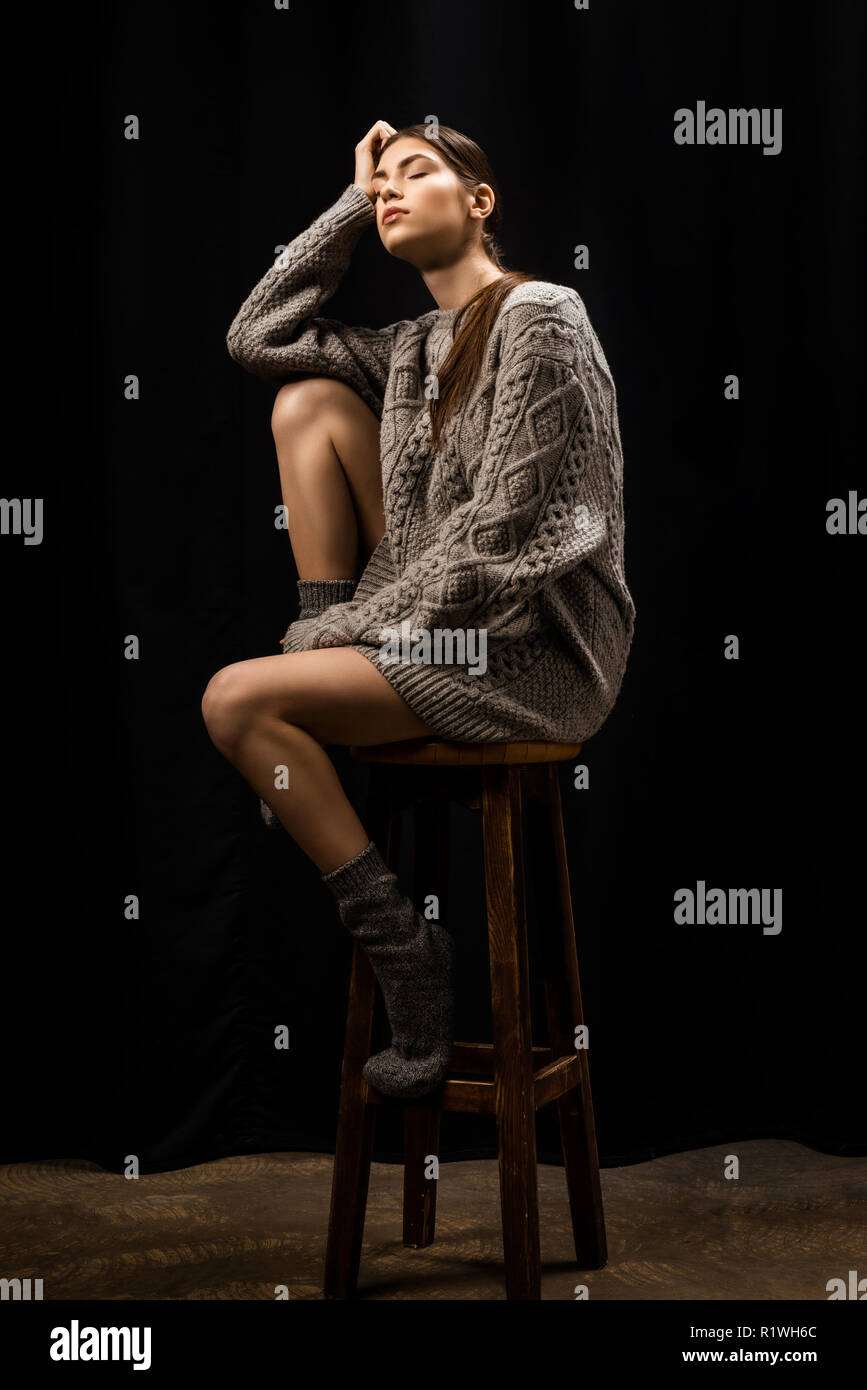 Young woman sitting on bar stool hi-res stock photography and images ...