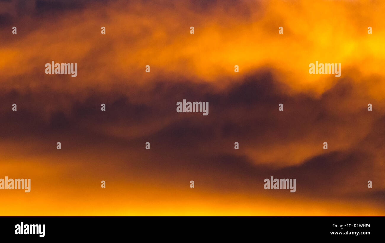 Background texture of dramatic sunset sky with orange clouds after ...