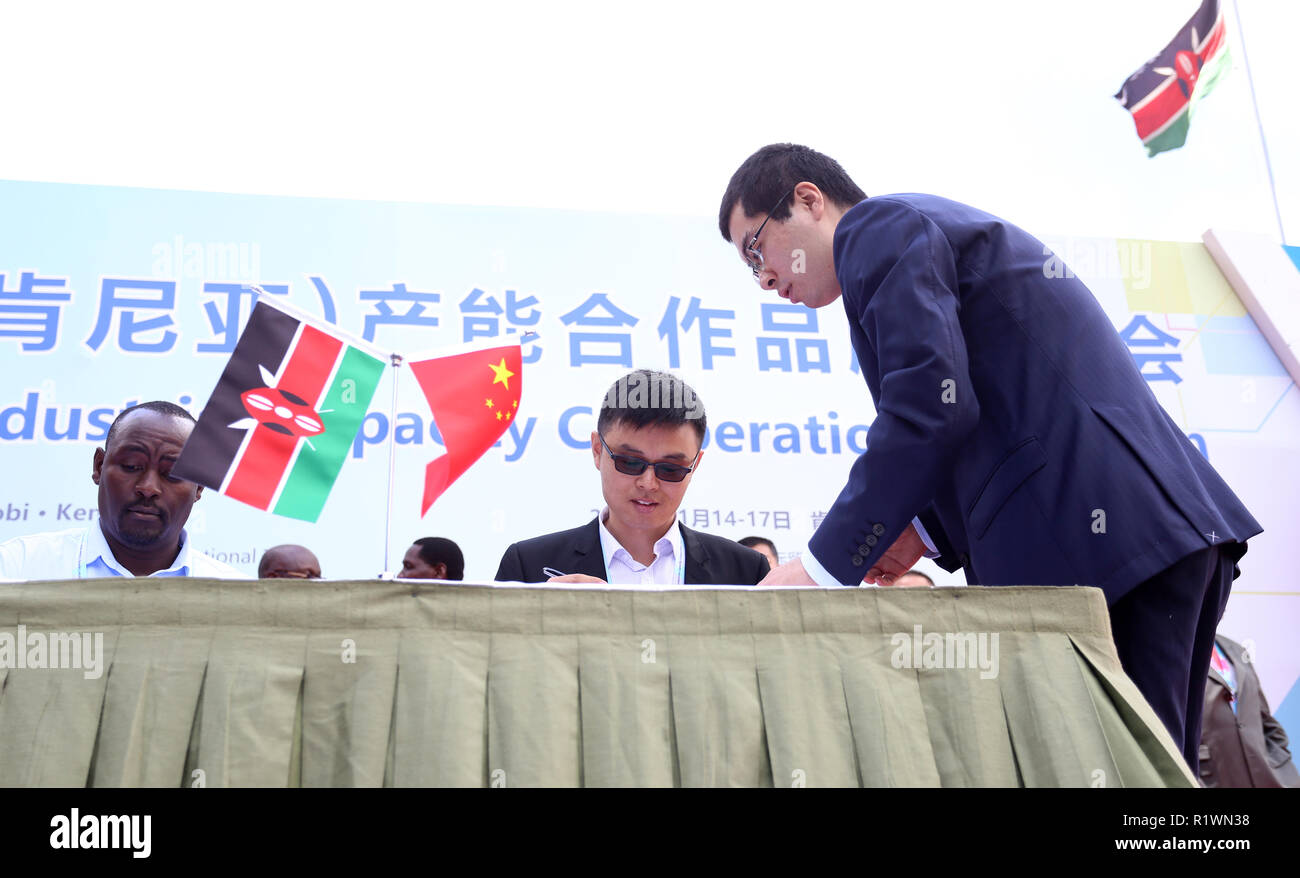 Investor representatives seen signing business agreements during the event. China and Kenya held an Industrial Capacity Cooperation Exposition in Nairobi, Kenya. It involved signing of bilateral cooperations in areas of infrastructure where production and process companies have set up base in African continent including Kenya. Stock Photo