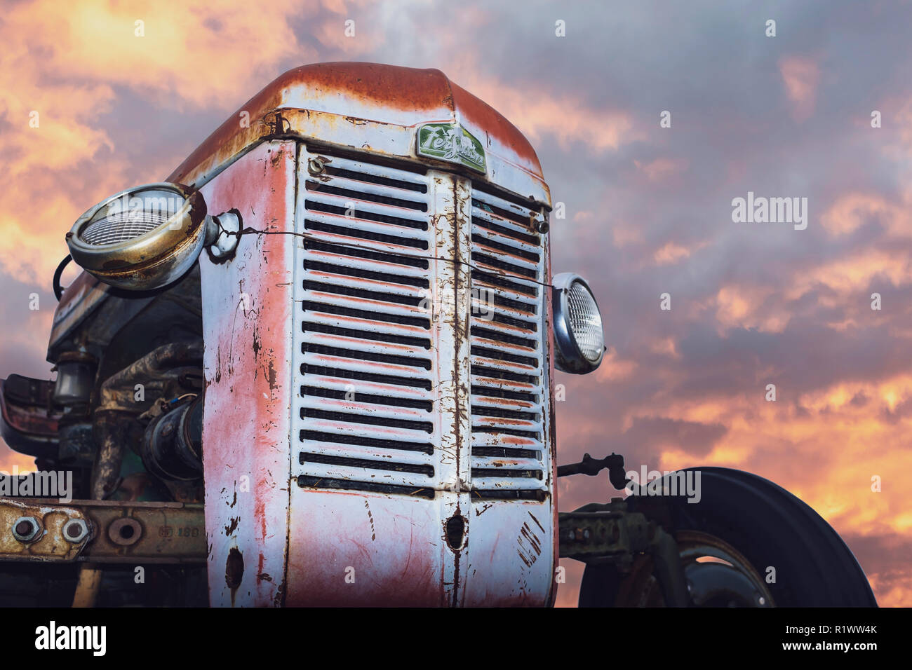 Proud Tractor Closeup - Sunset Sky Stock Photo