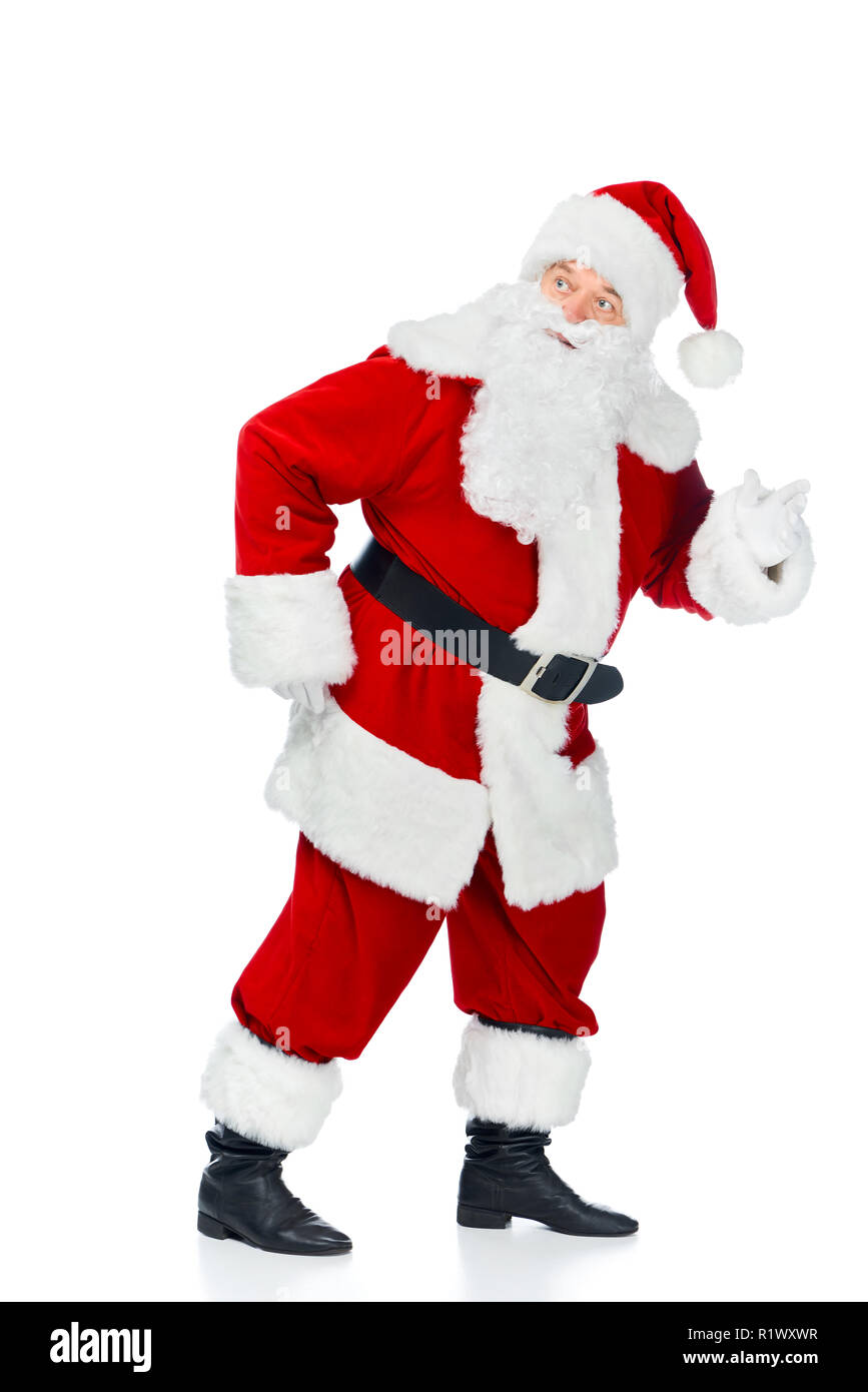 funny santa claus walking in red costume isolated on white Stock Photo