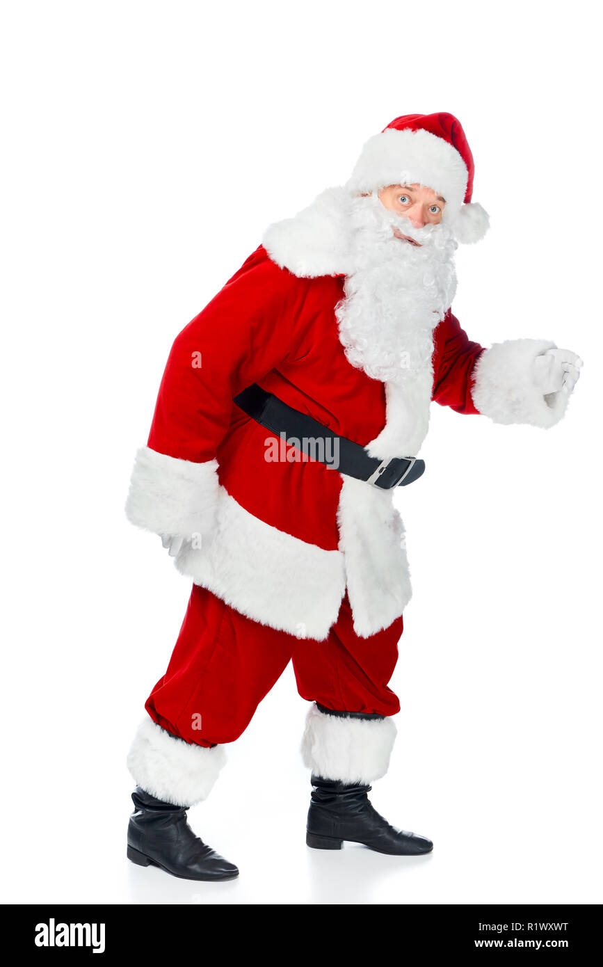 bearded santa claus walking in red costume isolated on white Stock Photo