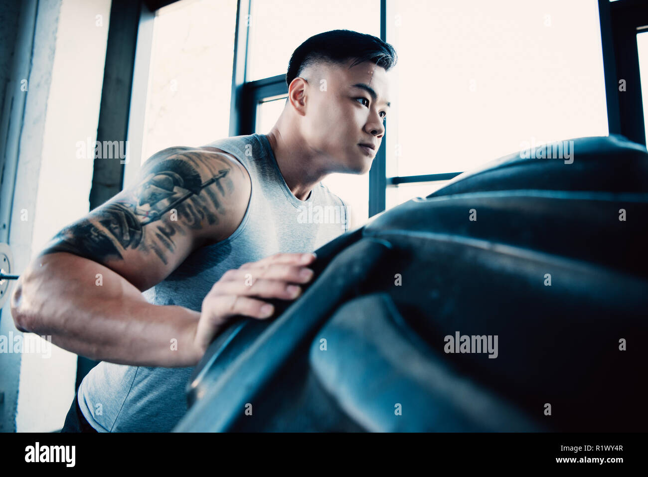 Man flipping tire hi-res stock photography and images - Alamy